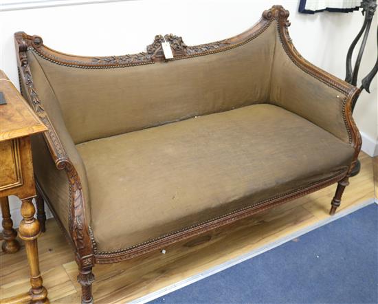 An Edwardian carved walnut settee, W.136cm